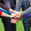 Multiracial Students with Hands on Stack