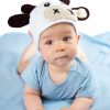 cute baby in a cow hat on blue blanket
